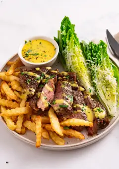 Forhåndsvisning av Steak and Fries, A plate of steak and fries with salad and sauce. gyldig fra 02.03.2026 | Side: 48